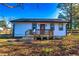 Exterior view of the home featuring a charming porch and well-manicured yard at 3625 Pointer Rd, Loganville, GA 30052