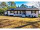 Charming one-story home featuring a cozy front porch and well-maintained landscaping at 3625 Pointer Rd, Loganville, GA 30052