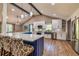Modern kitchen with stainless appliances, breakfast bar, and stylish pendant lighting over the island at 3625 Pointer Rd, Loganville, GA 30052