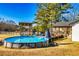 Backyard featuring an above-ground pool with a deck, pergola and a beautiful view of the surrounding landscape at 3625 Pointer Rd, Loganville, GA 30052