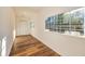 Bright room featuring wood floors, large windows, and fresh white walls at 3625 Pointer Rd, Loganville, GA 30052