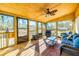 Relaxing screened porch with wooden floors and comfy seating at 3625 Pointer Rd, Loganville, GA 30052