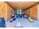 Large storage room with plywood walls and floor, offering ample space for organizing belongings and storage at 3625 Pointer Rd, Loganville, GA 30052