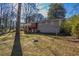 Back of house showing deck and yard at 6959 Biscayne Blvd, Rex, GA 30273