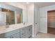 Modern bathroom with double vanity and walk-in shower at 1347 Sunny Lake Dr, Lawrenceville, GA 30043