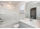 Clean bathroom with shower/tub and gray vanity at 1347 Sunny Lake Dr, Lawrenceville, GA 30043