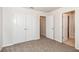 Well-lit bedroom featuring double doors to closet at 1347 Sunny Lake Dr, Lawrenceville, GA 30043