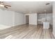 Open concept living room and kitchen with gray cabinets and vinyl flooring at 1347 Sunny Lake Dr, Lawrenceville, GA 30043