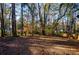 Large backyard with mature trees at 474 Fairlock Nw Ln, Atlanta, GA 30331