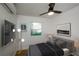 Serene bedroom with a modern ceiling fan, wall art, and large window letting in plenty of light at 474 Fairlock Nw Ln, Atlanta, GA 30331