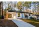 Charming renovated ranch with a bright blue door, new driveway, and modern carport at 474 Fairlock Nw Ln, Atlanta, GA 30331
