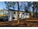 Back of house with mature trees at 474 Fairlock Nw Ln, Atlanta, GA 30331