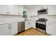 Updated kitchen with stainless steel appliances, white cabinets, and a modern design at 474 Fairlock Nw Ln, Atlanta, GA 30331