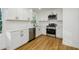 Well-lit kitchen featuring white cabinets, stainless steel appliances, and modern hardware at 474 Fairlock Nw Ln, Atlanta, GA 30331
