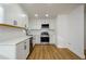 Modern kitchen with white cabinets, stainless steel appliances, and subway tile backsplash at 474 Fairlock Nw Ln, Atlanta, GA 30331