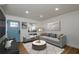 Cozy living room with hardwood floors, modern furnishings, and plenty of natural light at 474 Fairlock Nw Ln, Atlanta, GA 30331