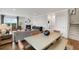 Spacious living and dining area with modern furnishings and a fireplace at 443 Village Ln, Fairburn, GA 30213