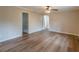 Bedroom boasts wood-look floors, neutral paint, and ceiling fan at 4485 Canary Ct, Lithia Springs, GA 30122