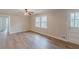 This home's bedroom shows new wood-look floors, ceiling fan, neutral paint, and natural light at 4485 Canary Ct, Lithia Springs, GA 30122