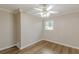 Cozy bedroom with wood floors, crown moulding, ceiling fan, and window offering a comfortable and well-lit space at 4485 Canary Ct, Lithia Springs, GA 30122