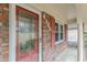 Charming brick home featuring a decorative glass front door and red shutters at 4485 Canary Ct, Lithia Springs, GA 30122