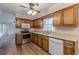 The kitchen boasts stainless appliances, wood cabinets, and wood-look floors at 4485 Canary Ct, Lithia Springs, GA 30122