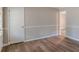 The space features neutral wall paint, wood-look floors, and molding at 4485 Canary Ct, Lithia Springs, GA 30122