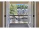 Inviting balcony view overlooking street of well-maintained townhomes across the way at 1081 Liberty Pkwy, Atlanta, GA 30318