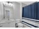 Bathroom with a single sink, toilet, shower with curtain and view to the bedroom at 1081 Liberty Pkwy, Atlanta, GA 30318