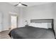 Cozy bedroom with a gray upholstered headboard and gray wood-style flooring at 1081 Liberty Pkwy, Atlanta, GA 30318