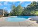 Inviting community pool surrounded by lush greenery, providing a serene relaxation space at 1081 Liberty Pkwy, Atlanta, GA 30318