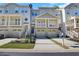 Charming townhome with private garages and inviting covered porches and front yard at 1081 Liberty Pkwy, Atlanta, GA 30318