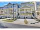 Charming townhome exterior with attached garage, private balcony, and well-maintained landscaping at 1081 Liberty Pkwy, Atlanta, GA 30318