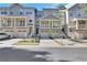 Stylish townhomes feature attached garages, inviting balconies, and professionally manicured landscaping at 1081 Liberty Pkwy, Atlanta, GA 30318