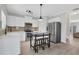 Modern kitchen featuring stainless steel appliances and a breakfast bar table at 1081 Liberty Pkwy, Atlanta, GA 30318