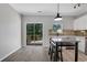 Eat-in kitchen featuring a kitchen island with deck access at 1081 Liberty Pkwy, Atlanta, GA 30318