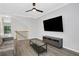 Living room featuring an entertainment center and modern wood flooring at 1081 Liberty Pkwy, Atlanta, GA 30318