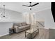 Spacious living room with modern lighting and adjacent staircase at 1081 Liberty Pkwy, Atlanta, GA 30318