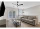 Living room with a sofa, an entertainment center, and an adjacent balcony at 1081 Liberty Pkwy, Atlanta, GA 30318