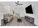 Living room with wood flooring, a sofa, and an entertainment center at 1081 Liberty Pkwy, Atlanta, GA 30318