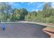 Community playground with seating and surrounding wooded area provides outdoor recreation at 1081 Liberty Pkwy, Atlanta, GA 30318