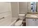 Clean bathroom with granite countertop, tub, and toilet at 1624 Graystone Dr, Hampton, GA 30228
