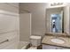 Clean bathroom with granite countertop, tub, and toilet at 1624 Graystone Dr, Hampton, GA 30228