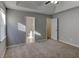 Bright bedroom featuring carpet, ceiling fan and access to bathroom at 1624 Graystone Dr, Hampton, GA 30228
