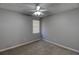 Bright bedroom with ceiling fan and carpeting at 1624 Graystone Dr, Hampton, GA 30228