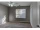 Well lit bedroom with carpet, ceiling fan, and neutral walls at 1624 Graystone Dr, Hampton, GA 30228