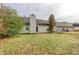 Back exterior view of house with yard at 1624 Graystone Dr, Hampton, GA 30228