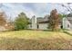 Back exterior view of house with yard at 1624 Graystone Dr, Hampton, GA 30228