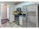 Stainless steel appliances and granite countertops in this kitchen at 1624 Graystone Dr, Hampton, GA 30228