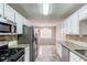 Kitchen with granite countertops and stainless steel appliances at 1624 Graystone Dr, Hampton, GA 30228